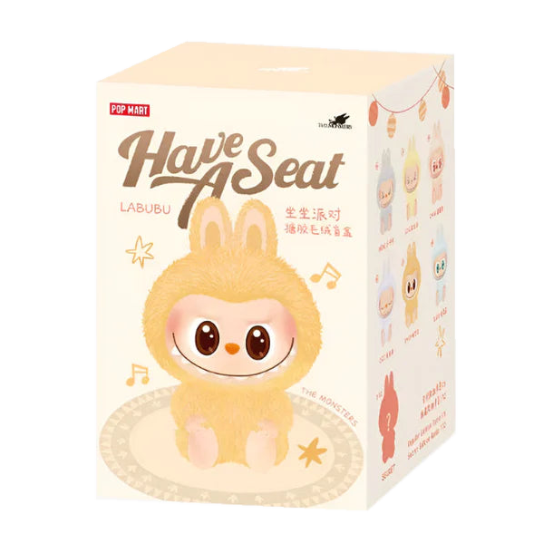 Pop Mart Labubu Have A Seat – blindboxens förpackning med gul figur på framsidan.
